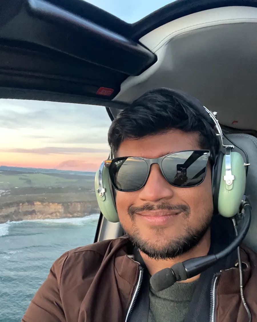 Sandeep in a helicopter above the coast